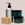Acure skincare products including a bottle, jars, and soap on a beige background